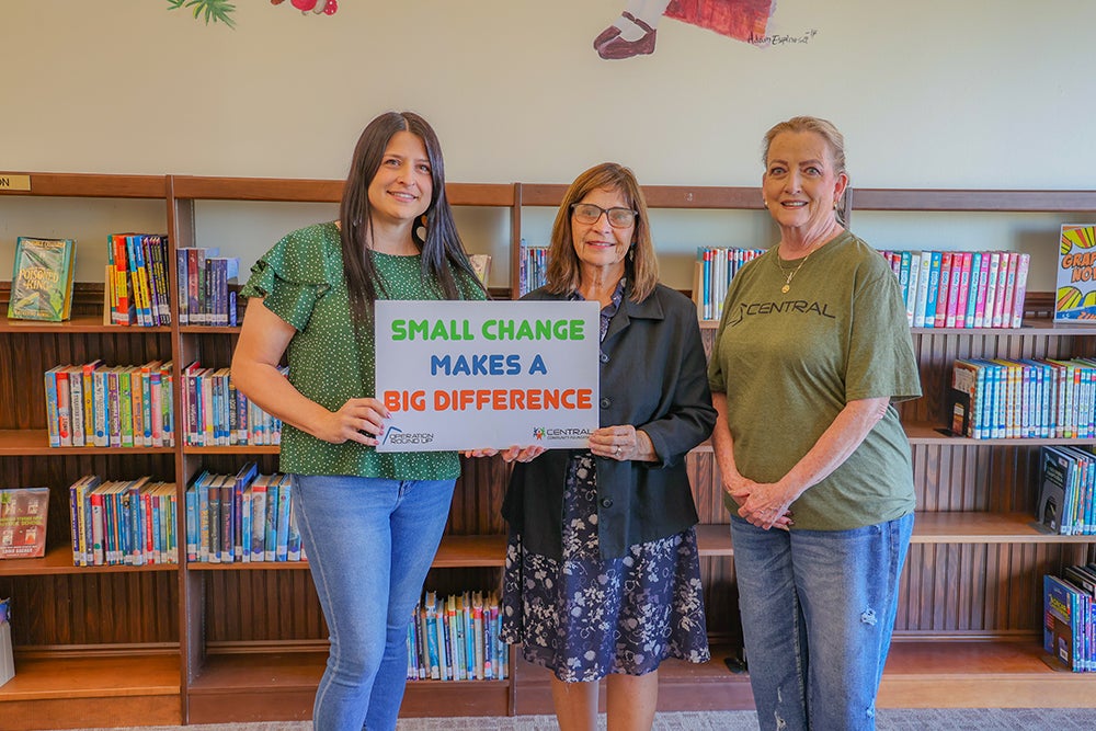 Chandler Public Librarians Amanda Cross and Sandy Tharp-Thee accept a grant from the Central Community Foundation board member, Gretchen Harlow. 