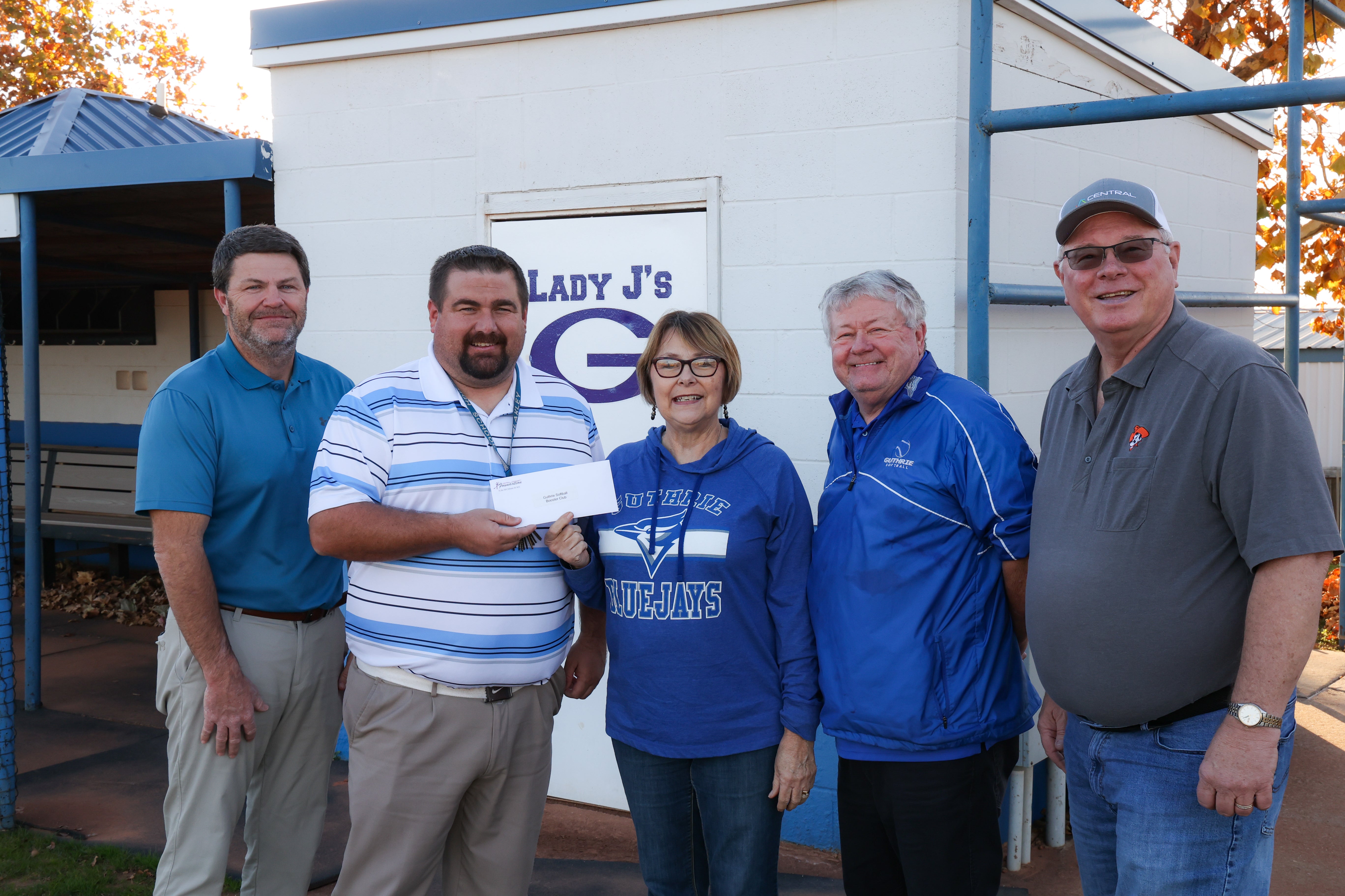 Shawn Ingle, Guthrie Booster Club President; Booker Blakely, Guthrie High School softball coach; Central Foundation board member Janie Carey; Ron Gillett, Guthrie Junior High softball coach; and Central board member Sid Sperry.