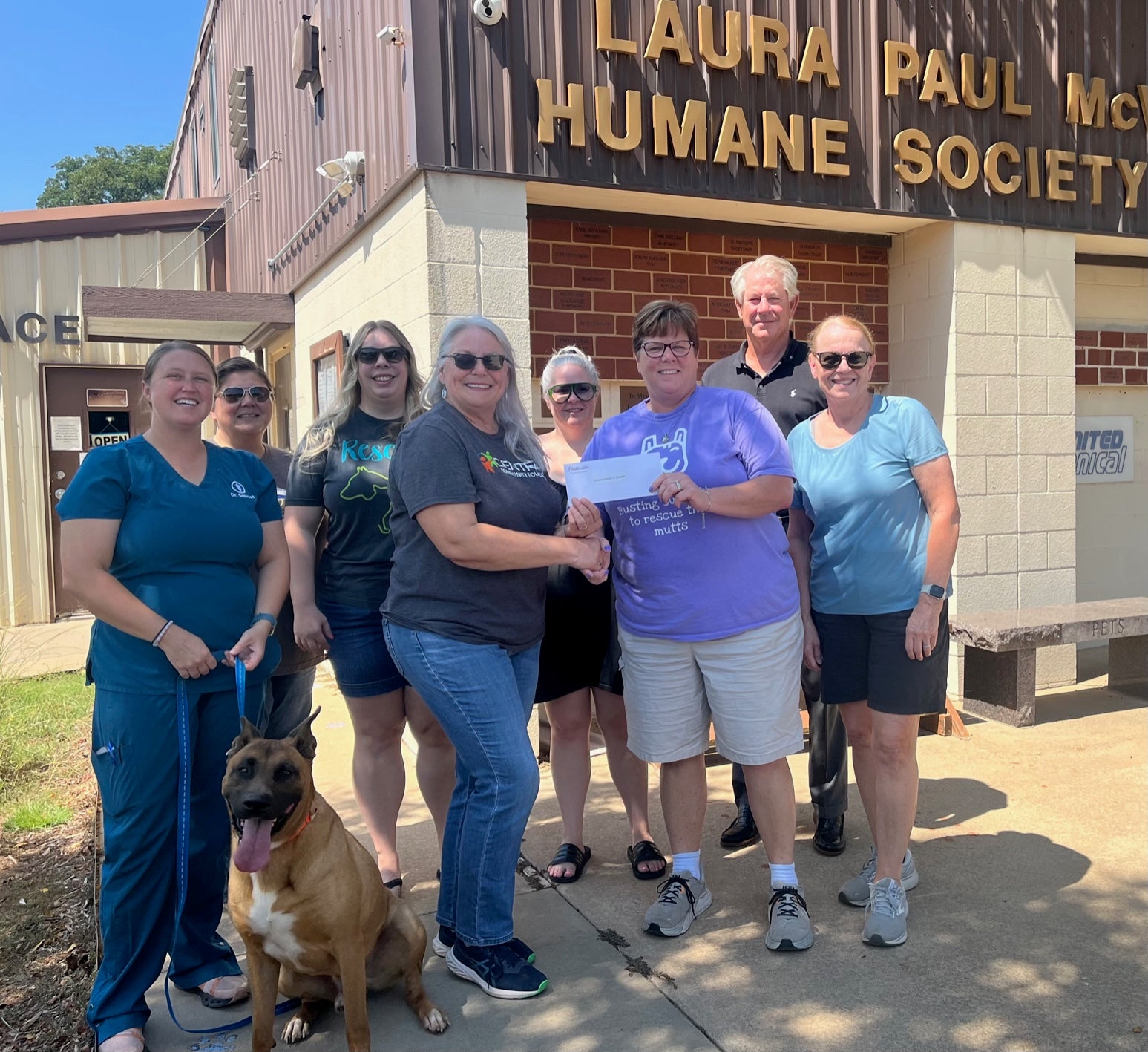 From left to right: Melanie Secrest, Stephanie Peetoom, Max the dog, Melissa Tillotson, Central Community Foundation board member Donna Dollins, Cylene Walker-Willis, Jackie Ross-Guerrero, Central Trustee Ken Starks, and Ruthie Francis.