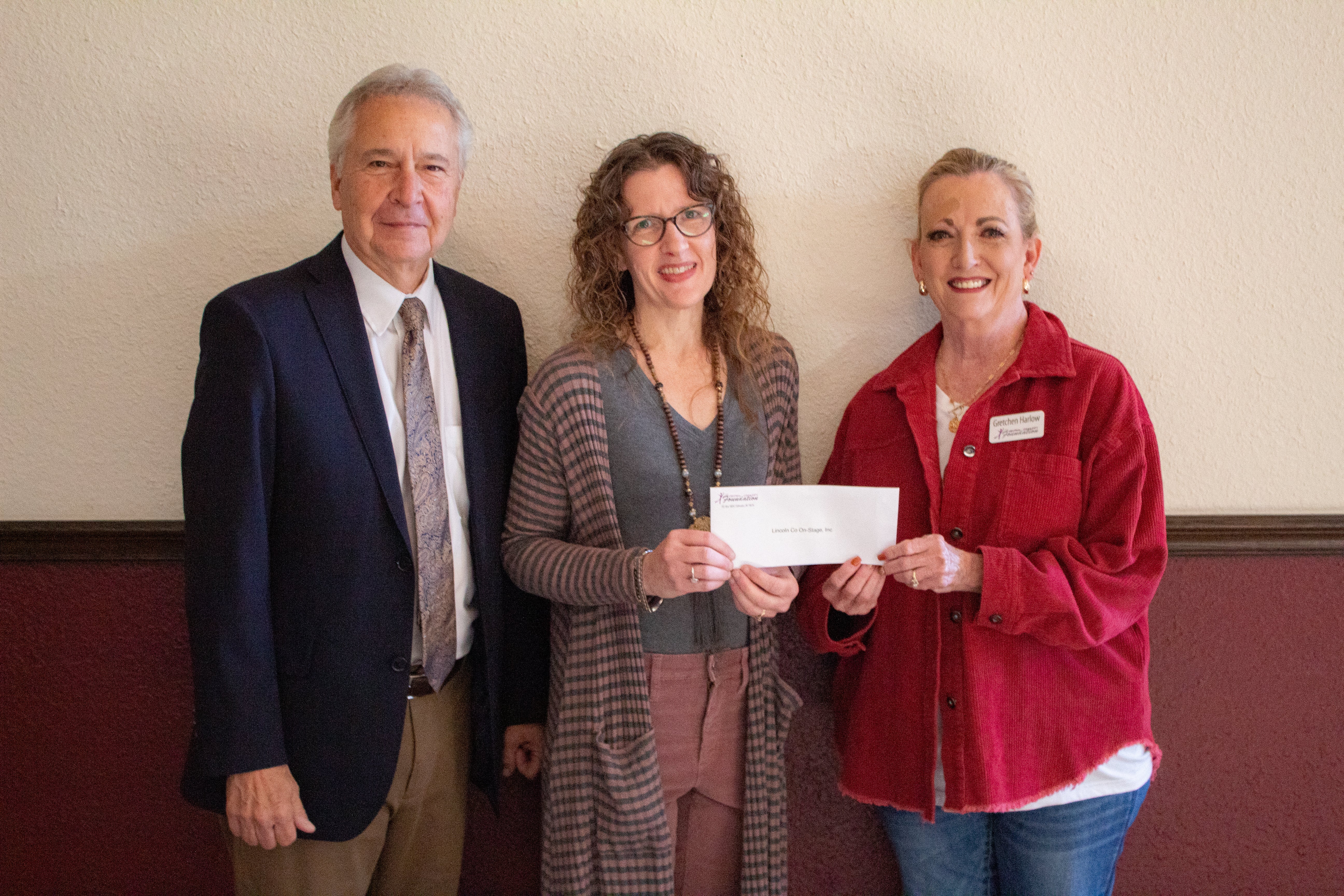 On Stage’s Larry Lenora and Mandy Myers is presented a grant by Central Community Foundation Board Member Gretchen.