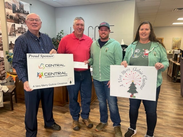 From left to right: Central trustee, Sid Sperry; Central Community Foundation board member, Steve Jones, present a foundation grant to A Very Merry Guthrie Christmas Director of Fundraising, Aaron Huskey, and Treasurer Lisa Hoover.